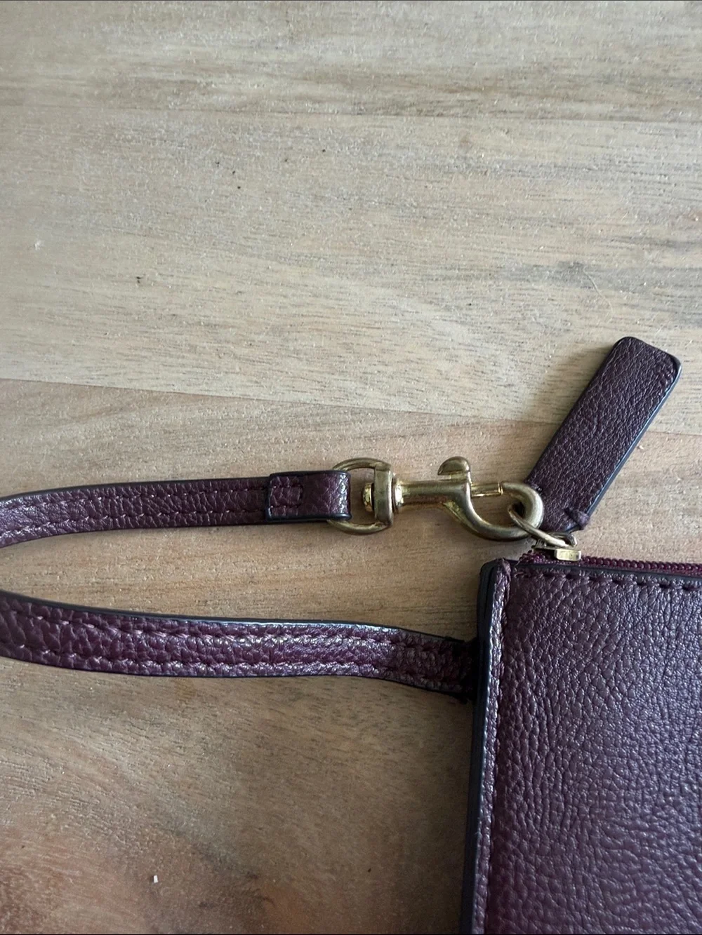Calvin Klein Dark Brown almost maroon like Leather Wristlet Pouch with Gold Logo
